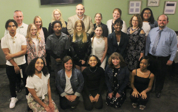 Group photo of the top 10 8th grade students and the teachers they invited for a dinner in their honor