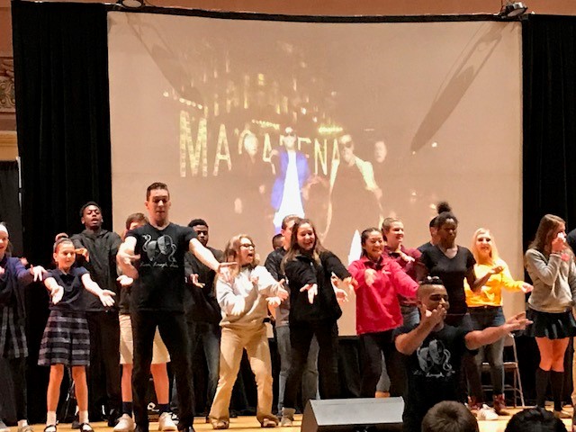 FAHS students on stage participating in a dance during the interactive portion of the show
