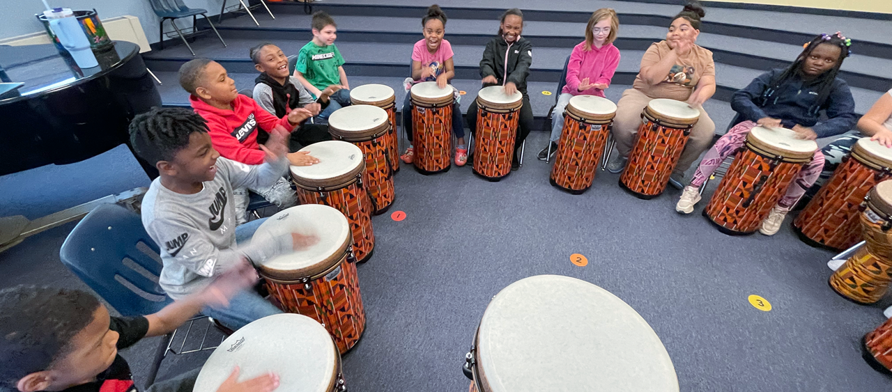 Elementary students jamming out during their drumming unit in music class