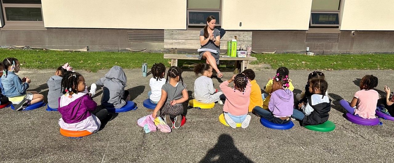 Pre-K students learning outdoors